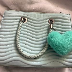 Light blue medium size purse;comes with detachable fluffy heart keychain & strap